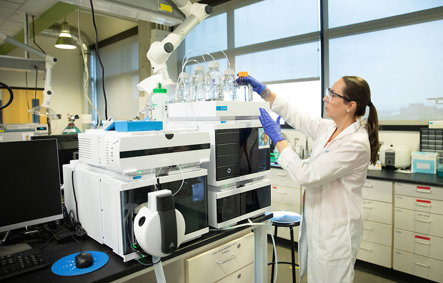 Chemistry professor works in a laboratory.